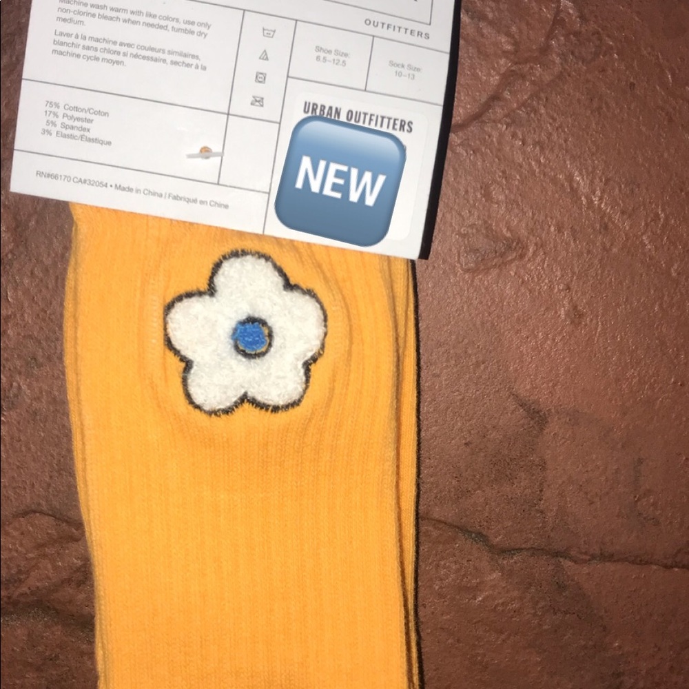 Cute orange socks with little white flower
